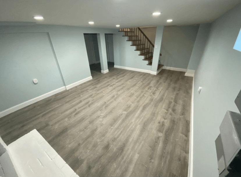 Custom shiplap wall with floating shelves and marble countertop