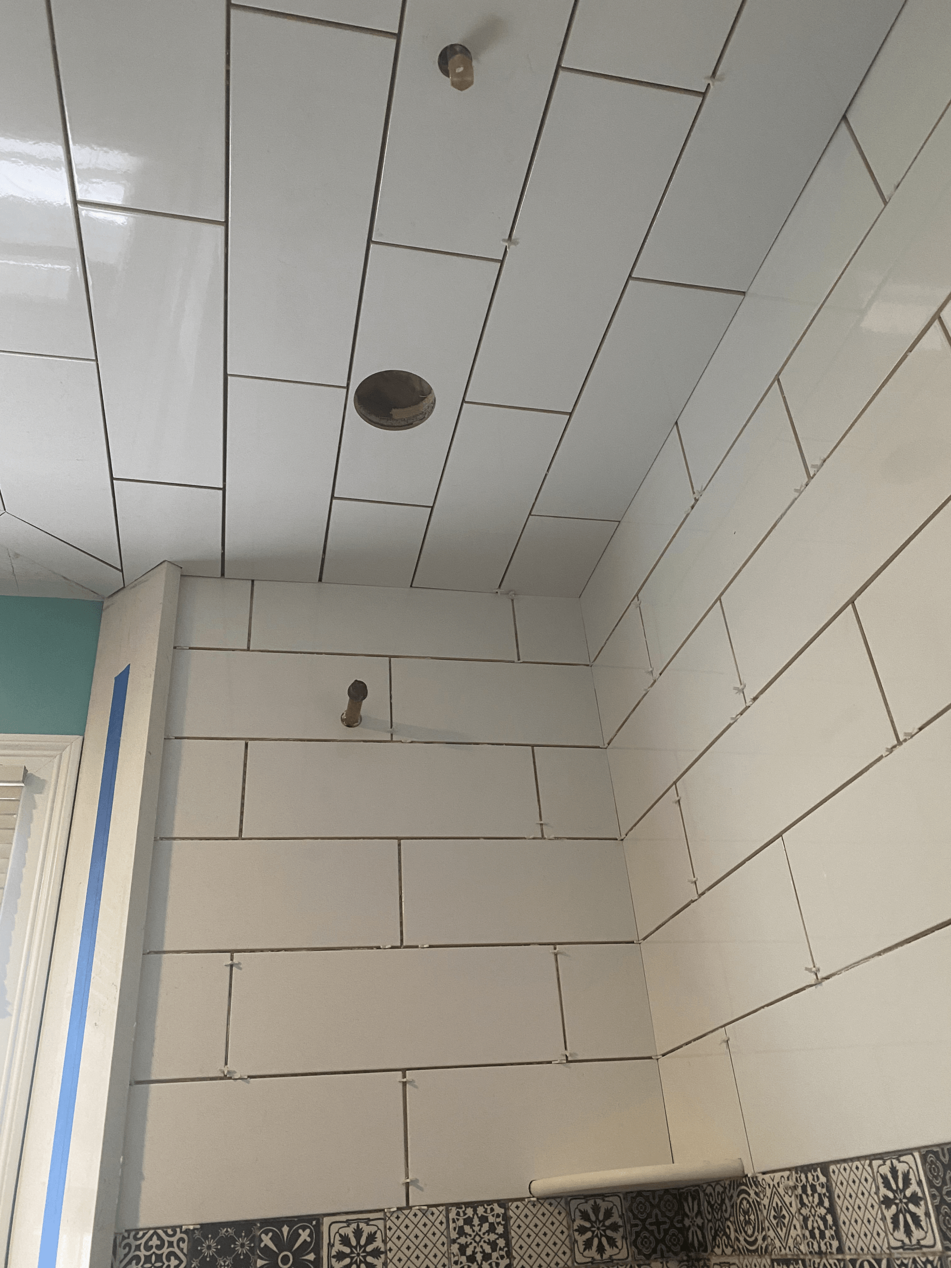 Kitchen mid-renovation with new herringbone backsplash